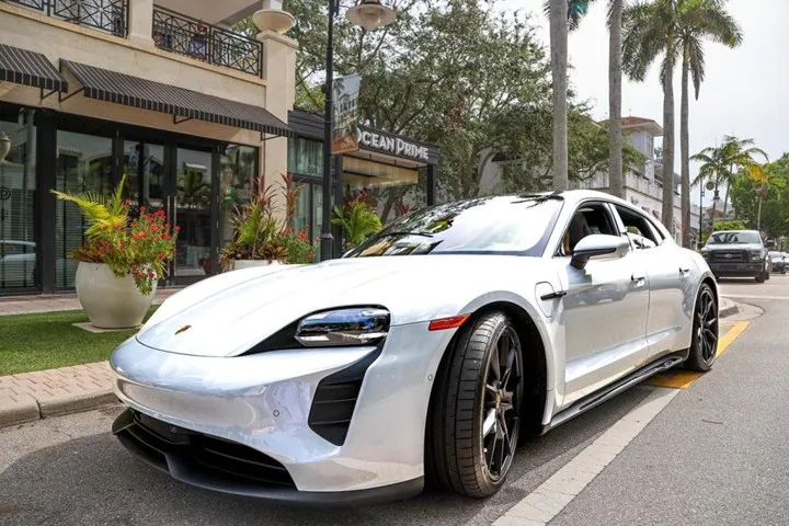 White Porsche in front of Porsche Studio Naples on Fifth Avenue