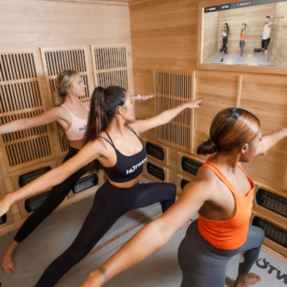 Women doing an infrared sauna workout at HOTWORX